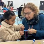 Cllr Horton with child at Let's Play Portsmouth event