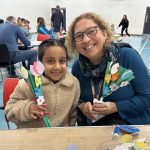 Cllr Horton with child at Let's Play Portsmouth event