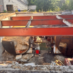 Plant room from above. Iron girders, tanks and rubble.