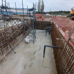 Inside the balance tank, steel mesh, concrete, scaffolding