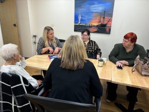 Council staff giving cost of living advice to a group of Portsea residents