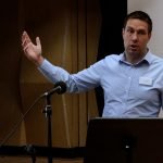 A male speaker at the social value event