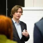 A male speaker at the social value workshop in 2023