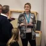 Three people discussing at the social value workshop in 2023