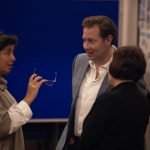 Three people discussing at the social value workshop