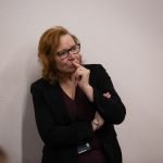 A lady listening intently at the social value workshop in 2023