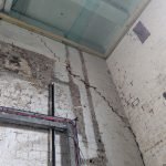 corner of building, internal view, failing brickwork