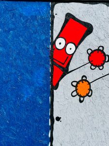 A smiley character painted on a wall